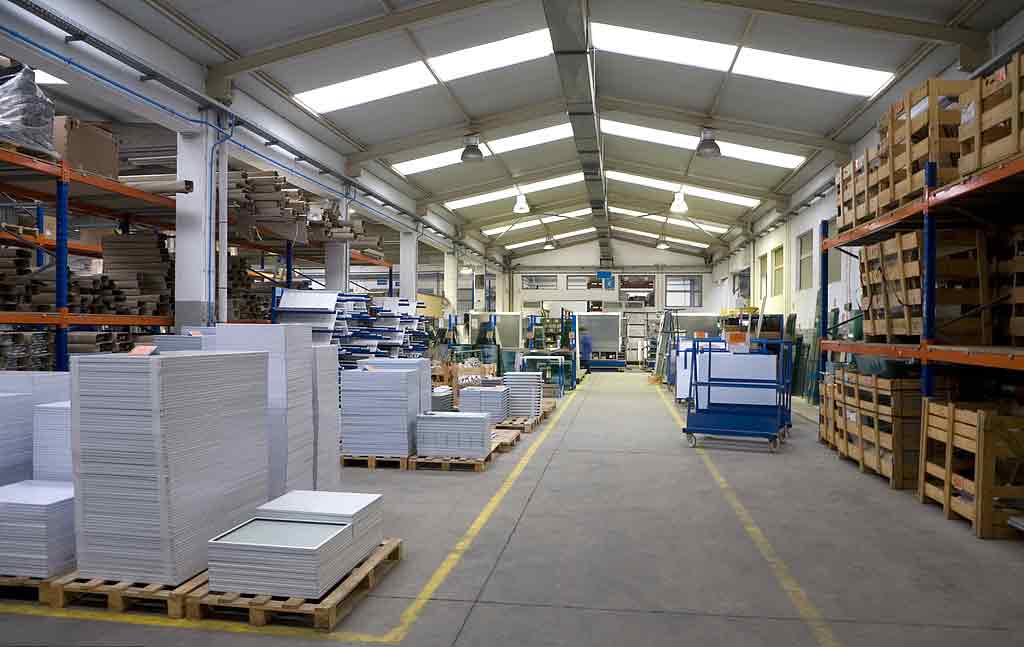 Large paper roll beside processing machinery